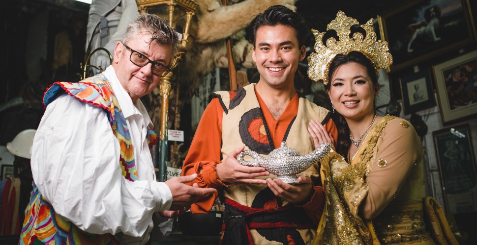 Joe Pasquale and cast of Aladdin hold the magical lamp